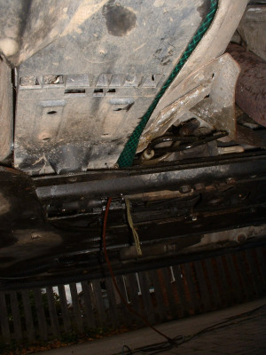 New pipe just visible hanging under engine bay
