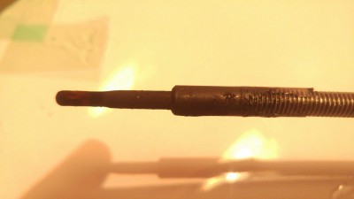Swollen end of the glow plug.
