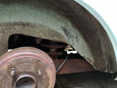 Witness mark on wheel tub where tyre has been catching