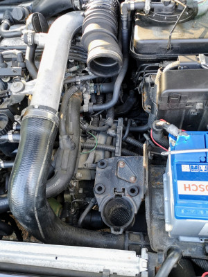 This engine bay gets an award for the sheer number of layers of stuff it has