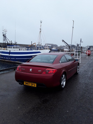 Car stood on it's feet before it falls into the river