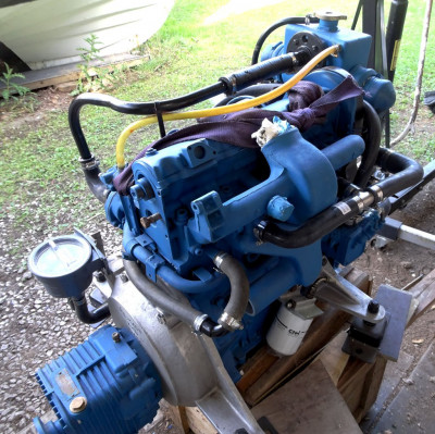 Here is the T split in the salt water pipe from the heat exchanger core into the exhaust manifold, to feed both sides of the Y shape. Also the heater outlet that goes to the oil cooler.