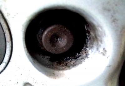 Pilot hole drilled in to wheel bolt