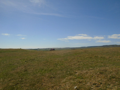 Small car, big landscape, big sky,