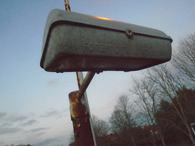 Curious label on a sawn off lighting column<br />next to our red-glower.