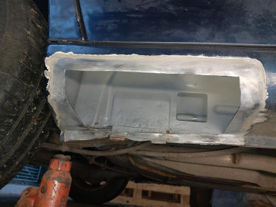 Rust cut out of sill, zinc rich primer applied inside section