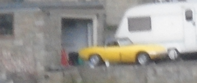 Howard's Gorgeous Yellow Lotus Elan takes a small trip outside the garage