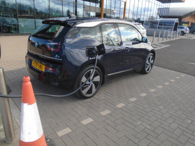 A Black BMW i3 plugged into the Osprey