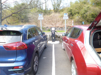 the red car and the blue car having a free drink together