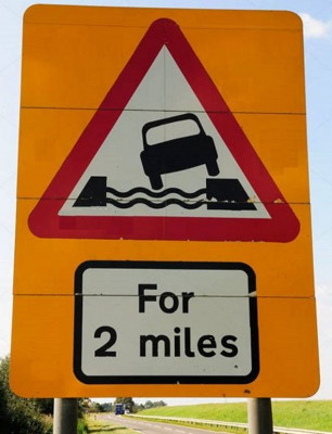 Water Course Alongside Road for 2 Miles Road Sign, Ten Mile Bank, near Littleport, Cambridgeshire, England, UK