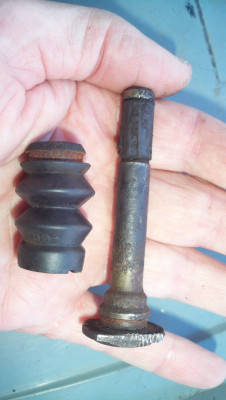 Front brake calliper guide pin - note rubber insert on the shaft