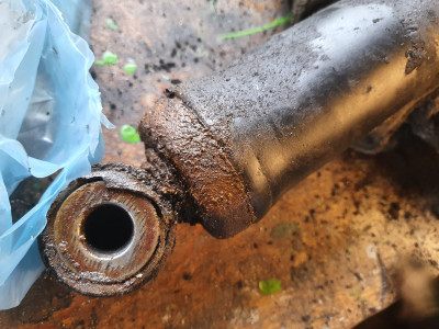 Lower end where it leaks.
