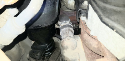 Wet, possible sign of a failed seal on the compressor side.