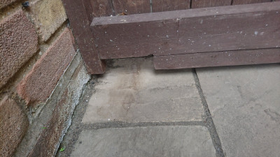 and out through the front gate where they leave their presents on the front lawn before retracing their steps to the house.