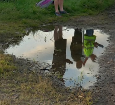 CitroJim Original (with a bit of cropping and zooming in).<br />Reflections in a Muddy Puddle with a strangely reminiscent shape of an island map.