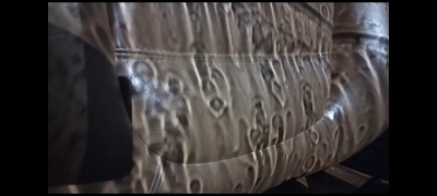 LED streetlamp generated projection of rain tumbling down the windscreen of a 2002 Coupe, viewed on a tan leather seat :) (think that covers it)