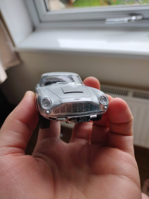 Partially de-bumpered Aston