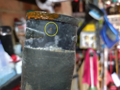 The pinprick hole circled