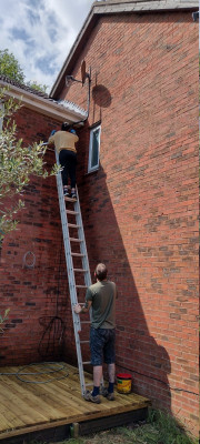 Removing the satellite disc.