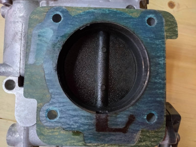 The manifold side/output of the throttle body