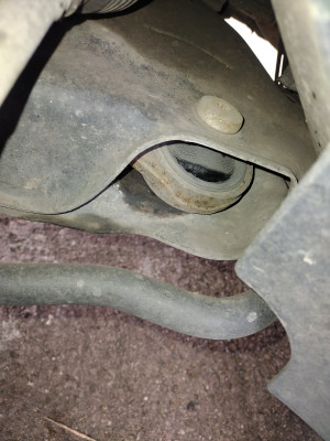 This is the passenger side wishbone rear bush looking worse for wear