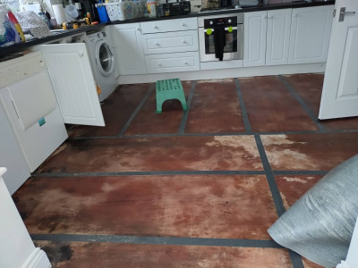 The sodden boarding on the concrete floor