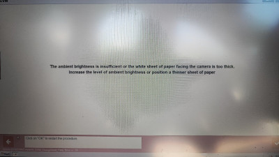 With paper on window screen over sensor