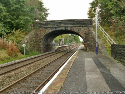 Station platform (low level) and Lobby Bridge, Gargrave for SD9353<br />Looking west, with the station buildings beyond. This is an unusual arrangement: regular trains of no more than four carriages stop the other side of the bridge along the raised section of platform, but the platform continues at its original height this side of the bridge to serve occasional longer charter trains