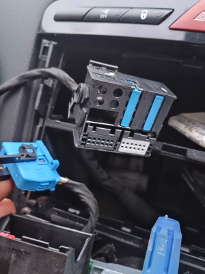 I've docked the small (new) connector in the radio's existing empty spot in its wiring plug