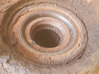 This is the back of the wheel bearing and the remains of the magnetic track are the crust around the edge