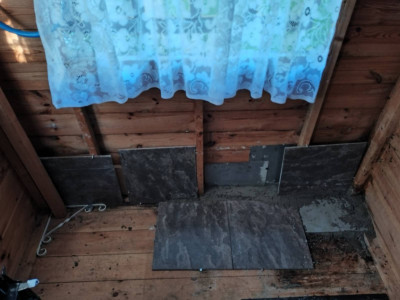 Concrete in the holes, then tiles cemented and pegged into place with three sheets of galvanised steel actually blocking the holes.
