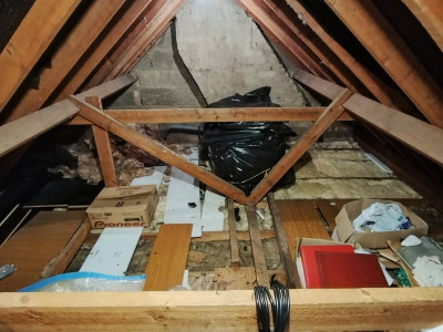 The disused tank is no longer surrounded with junk