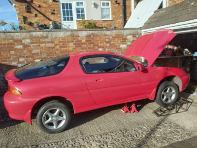 As it is now with o/s front wheel and ramp in temp place for extra safety while waiting. Car actually supported on the axle stands.