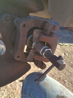 Wind back tool with caliper mounted without disk