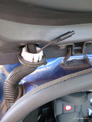 Rear camera cable routed through cable rubber duct