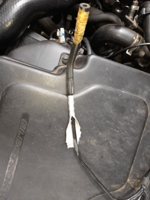 The melted vacuum pipe has been "sucked" flat by the vacuum